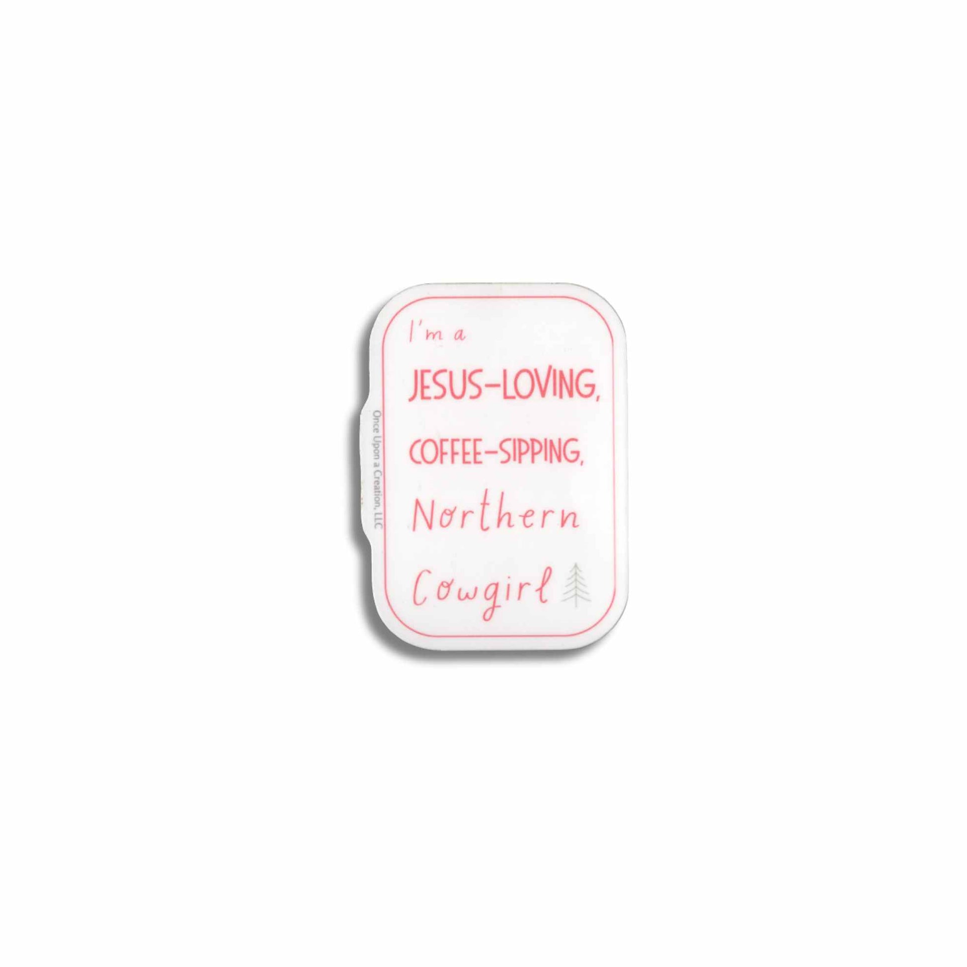 A small rectangular sticker with rounded corners, featuring the text 'I'm a JESUS-LOVING, COFFEE-SIPPING, Northern Cowgirl' in pink lettering on a white background with a thin pink border.
