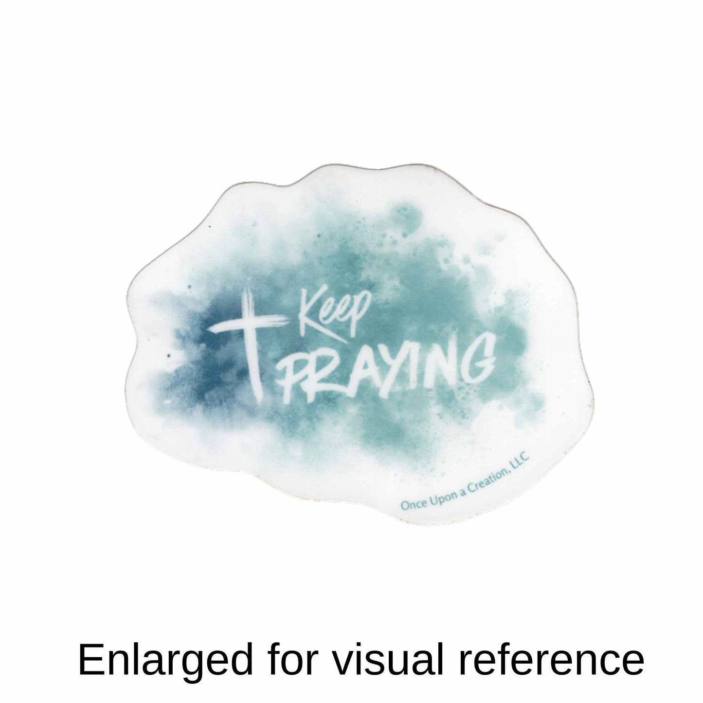 A white cloud-shaped sticker with a blue-green watercolor wash and the words 'Keep PRAYING' in white, shown on a white background.