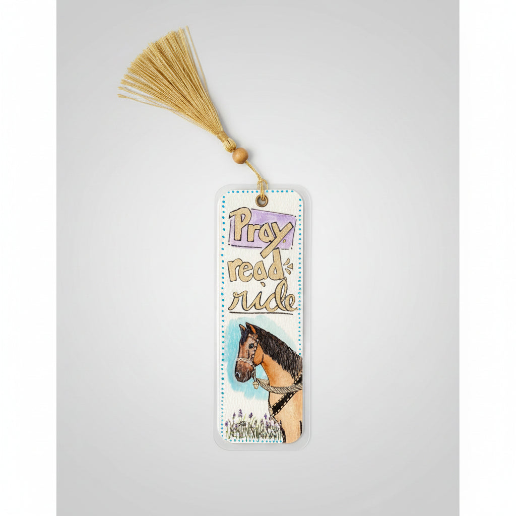 A rectangle laminated watercolor bookmark with a gold tassel, featuring the words 'Pray read ride' and an illustration of a horse.