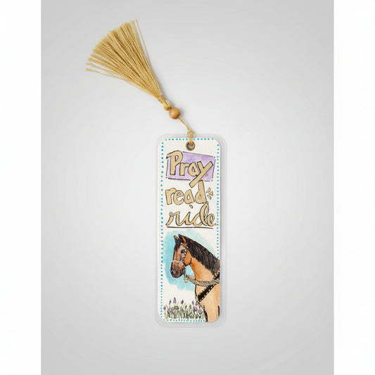 A rectangle laminated watercolor bookmark with a gold tassel, featuring the words 'Pray read ride' and an illustration of a horse.
