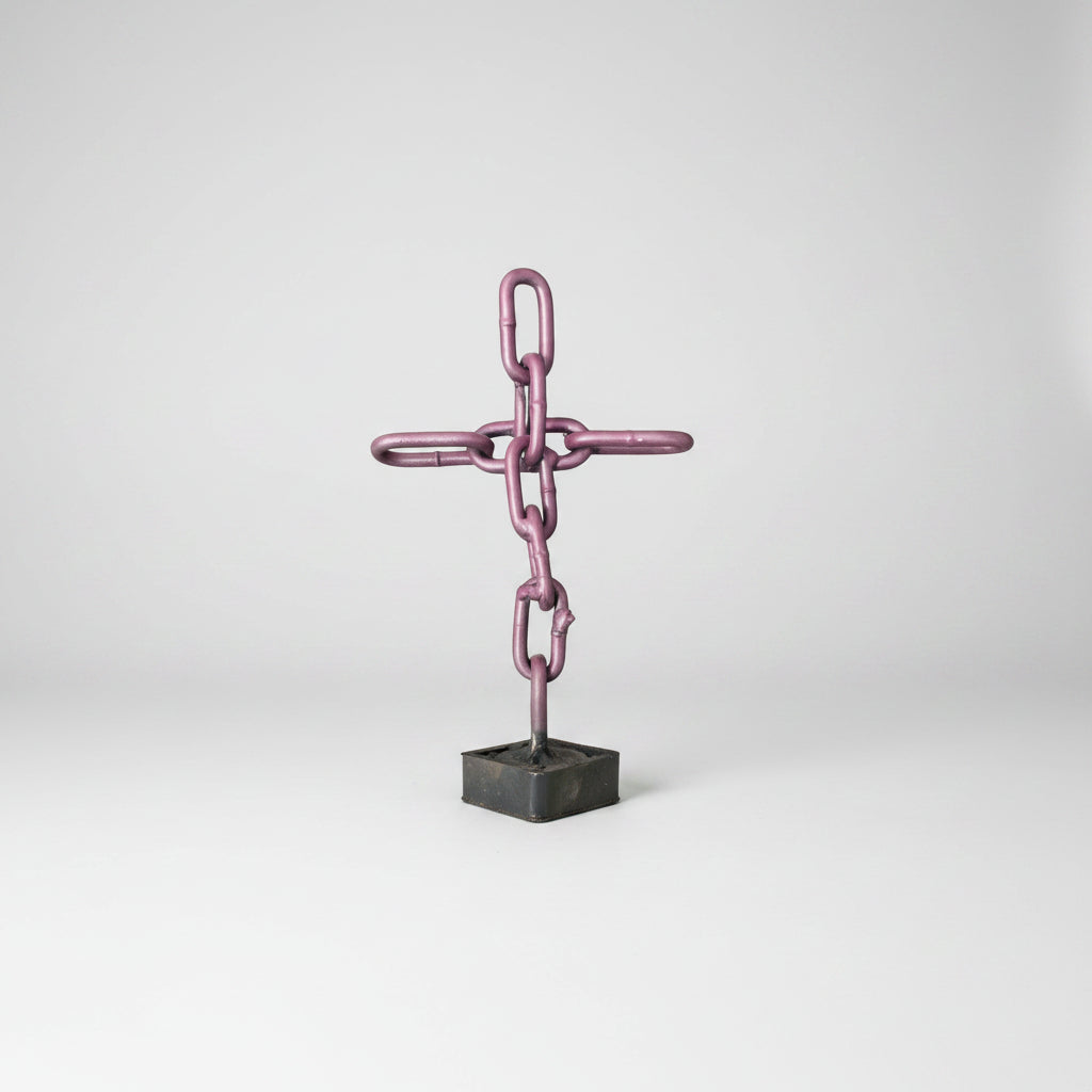 Purple scrap metal cross made of chain link chains. 