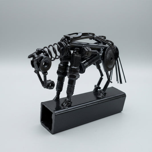 A black scrap metal reining horse mounted on square metal tubing.