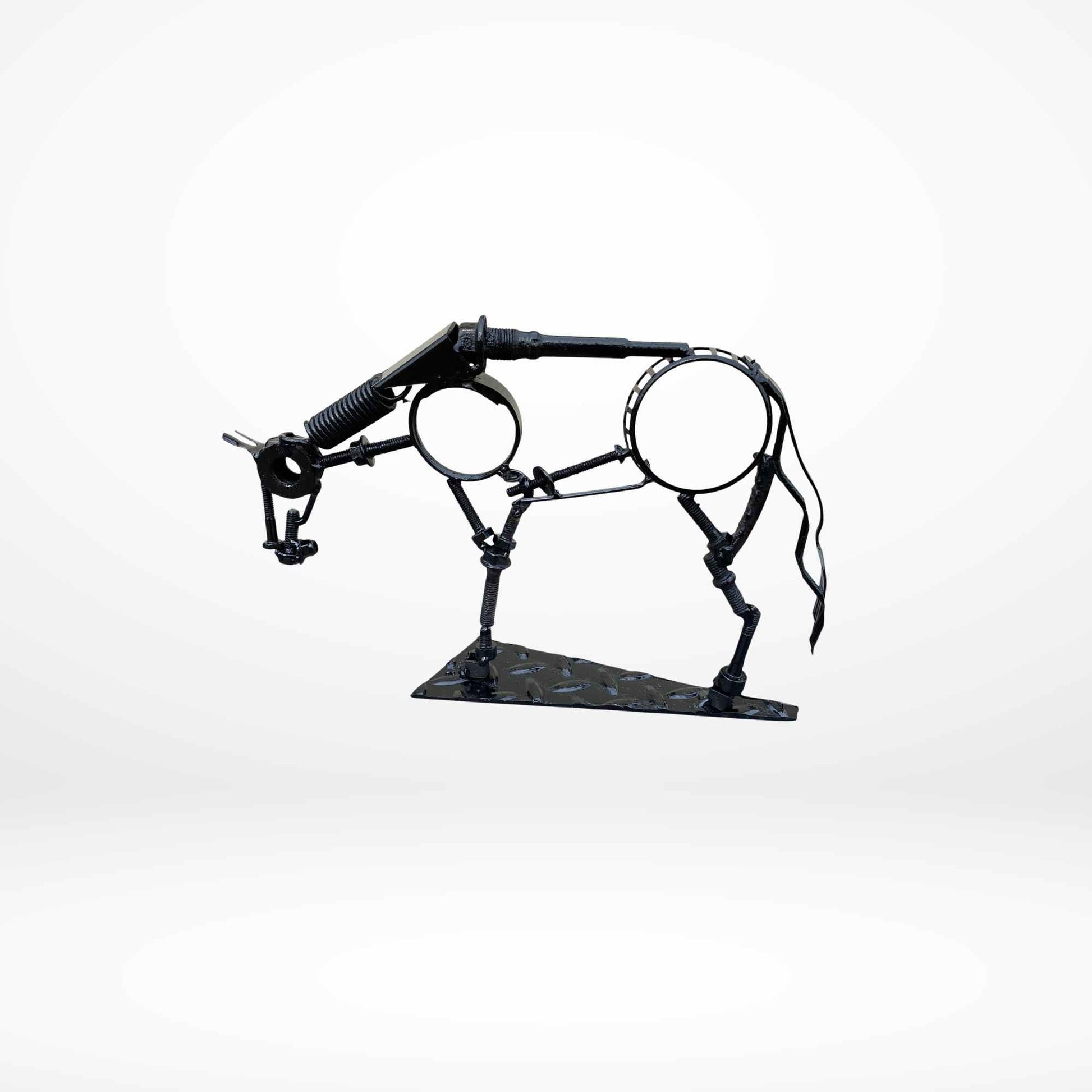 A scrap metal sculpture of a horse in a relaxed state of mind with its head low.