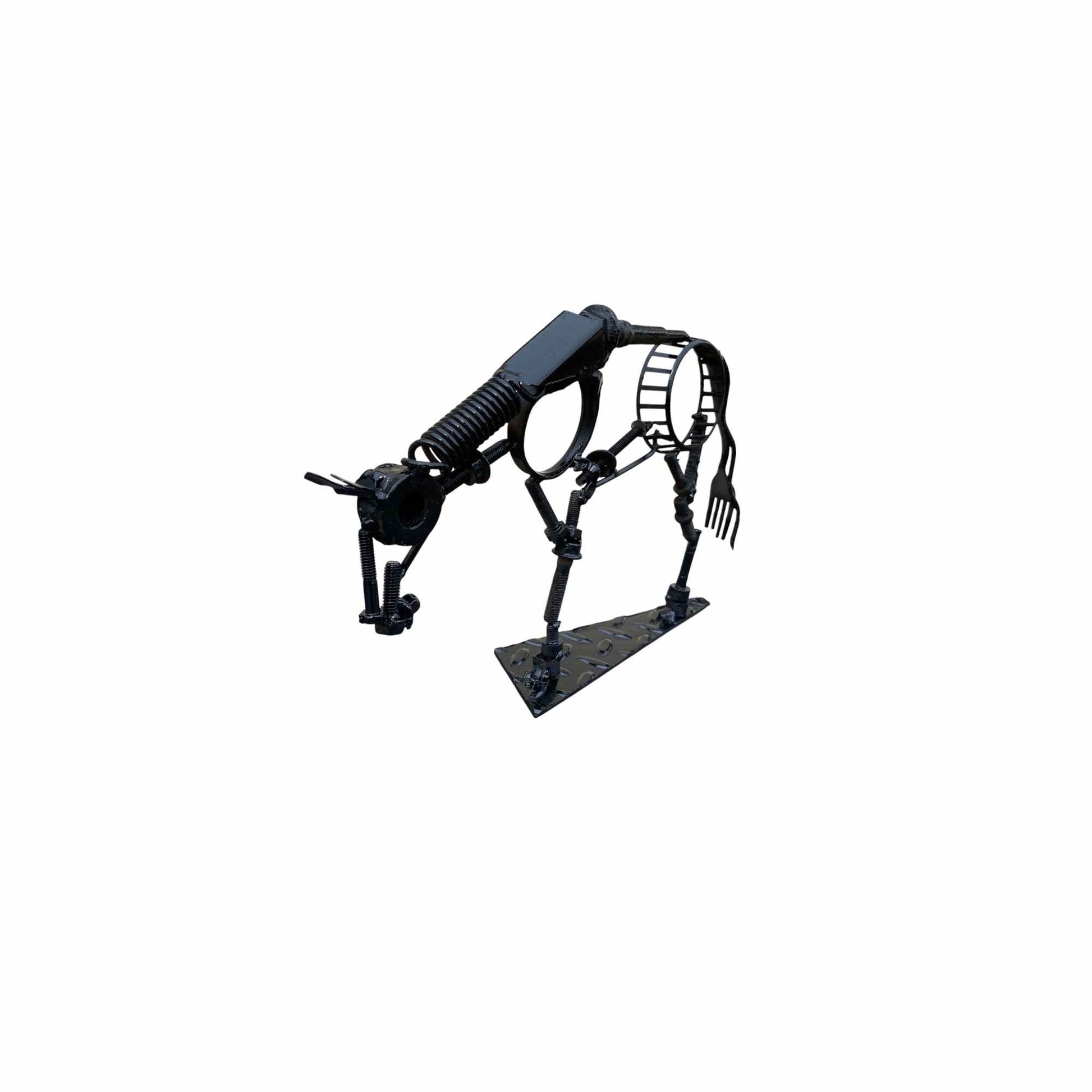 A scrap metal sculpture of a horse in a relaxed state of mind with its head low.