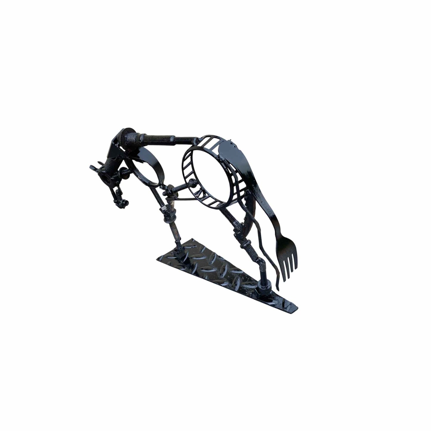 A black metal horse sculpture with a fork on its tail, standing on a diamond-plate style base against a plain white background.