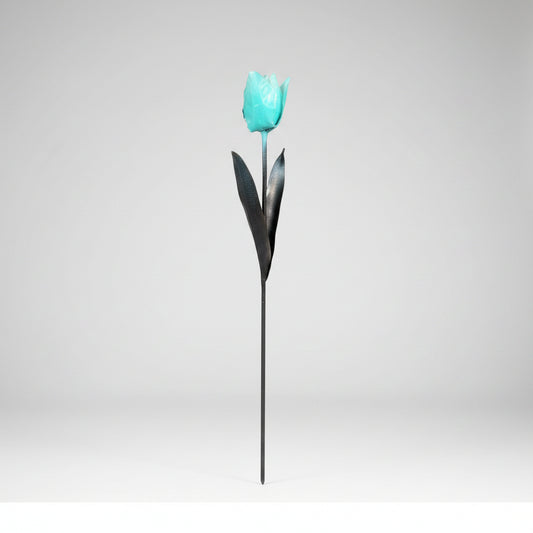 A light blue tulip metal garden art sculpture